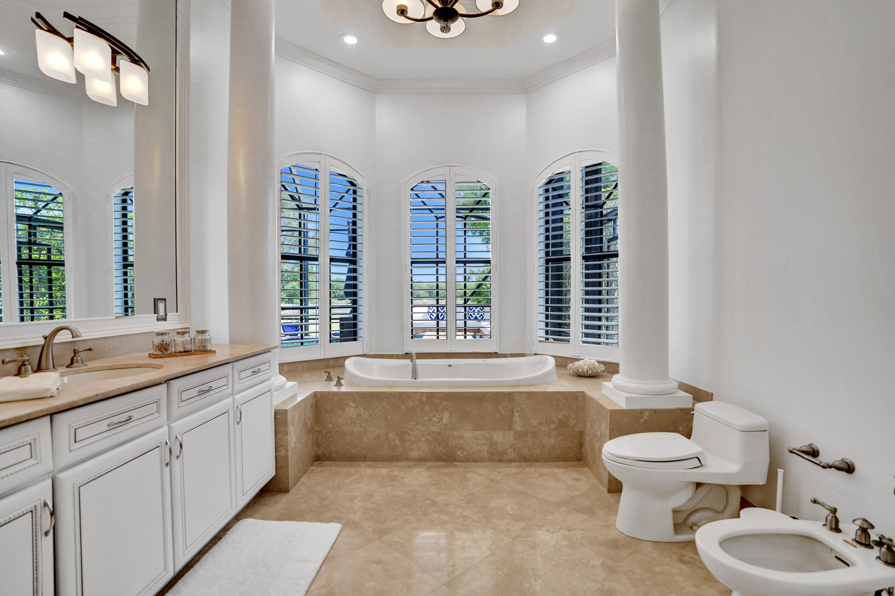 9210 Equus Circle Boynton Beach, FL 33472 - Photo 25 of 75 a bathroom with a granite countertop sink and a large mirror