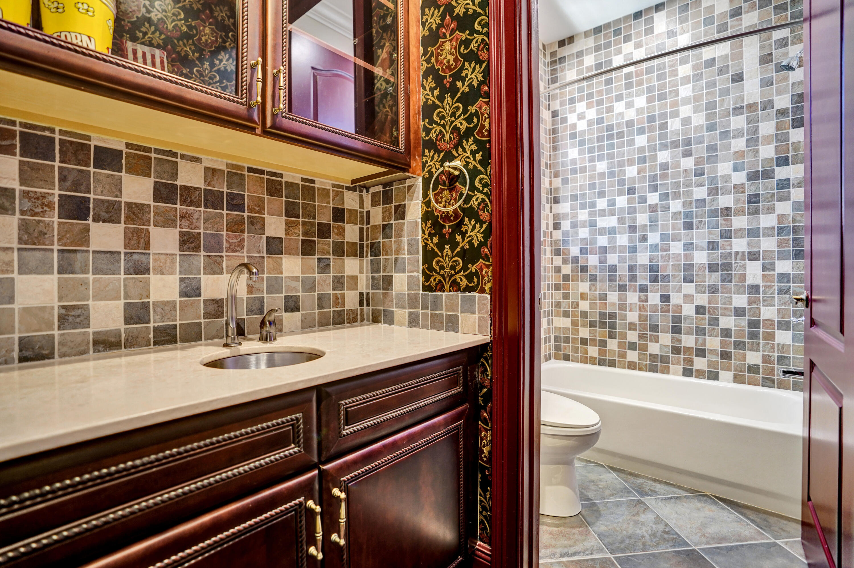 9210 Equus Circle Boynton Beach, FL 33472 - Photo 33 of 75 a bathroom with a sink a toilet a mirror and shower