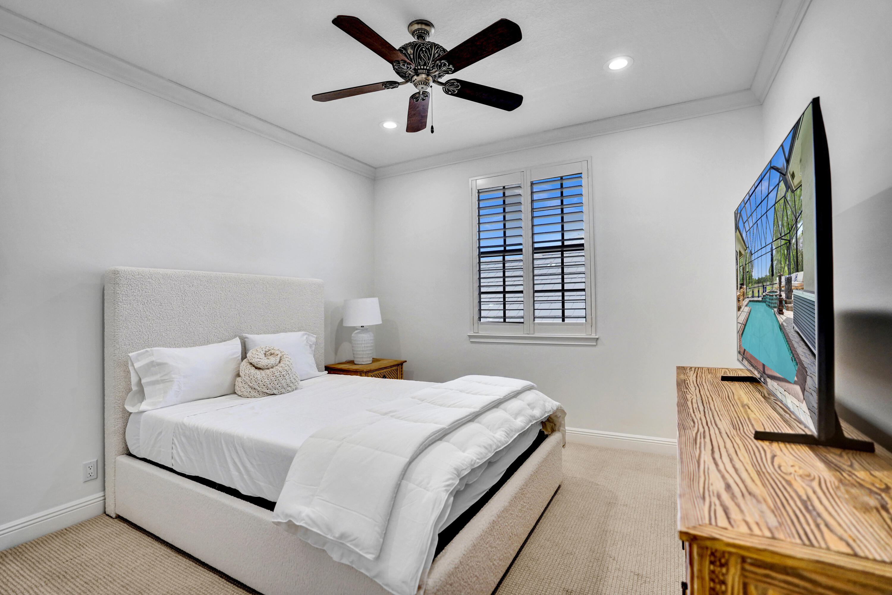 9210 Equus Circle Boynton Beach, FL 33472 - Photo 34 of 75 a bedroom with a bed and a flat screen tv