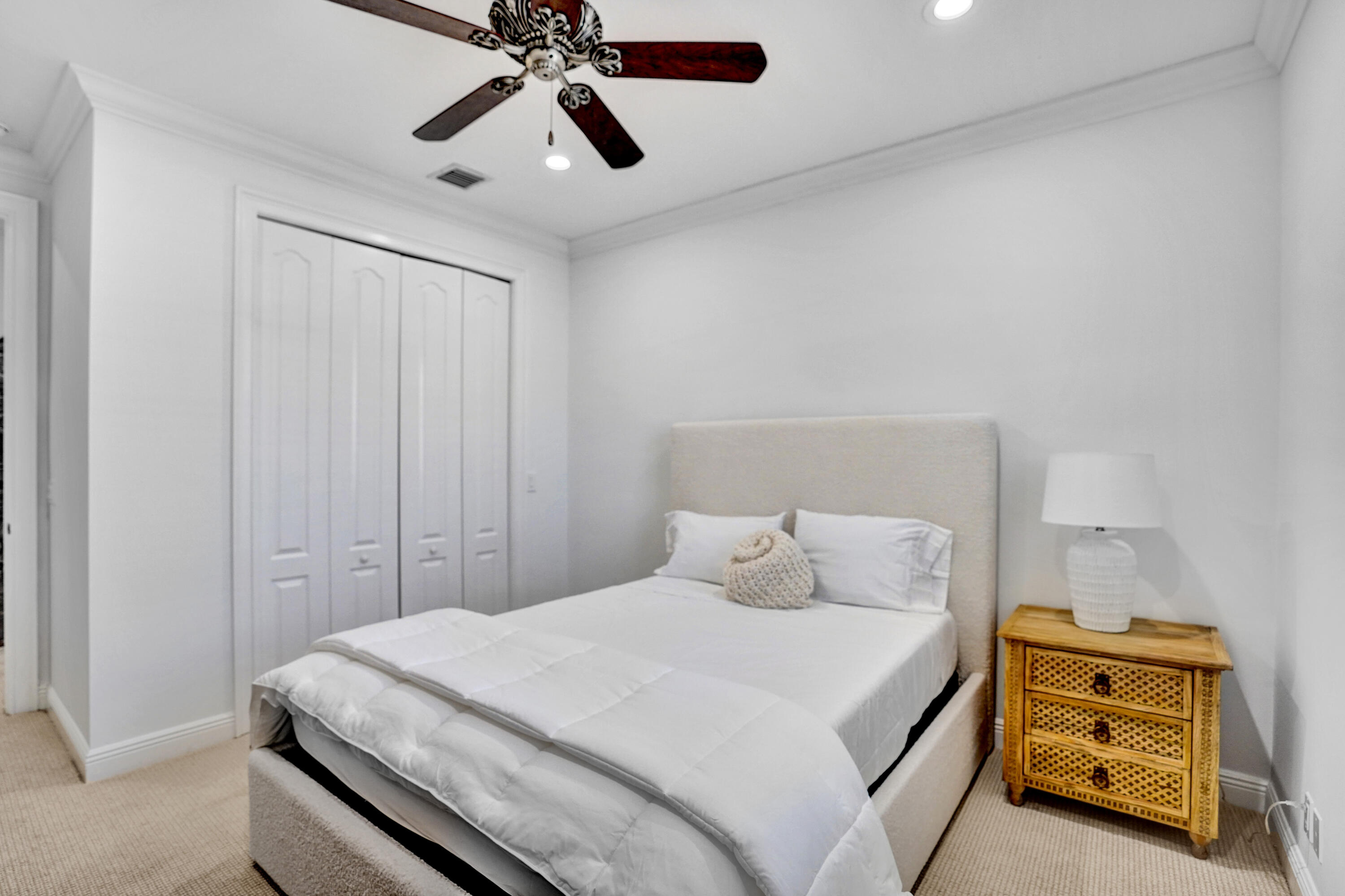 9210 Equus Circle Boynton Beach, FL 33472 - Photo 35 of 75 a bedroom with a bed and a chandelier