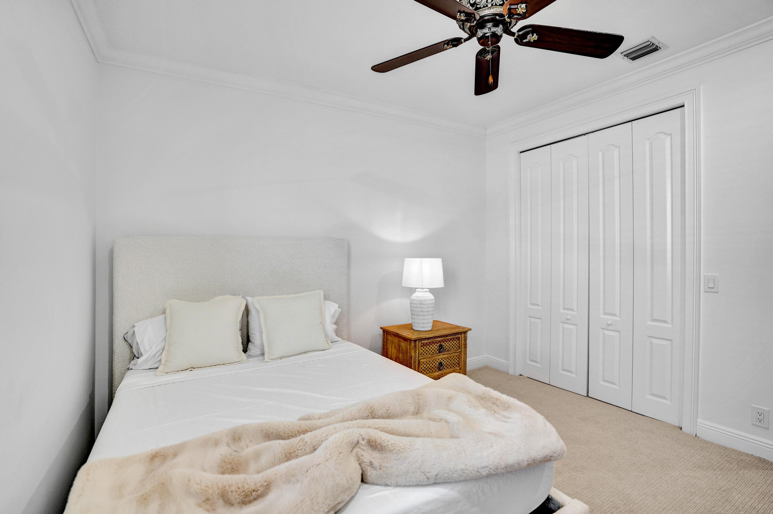 9210 Equus Circle Boynton Beach, FL 33472 - Photo 38 of 75 a bedroom with a bed and ceiling fan