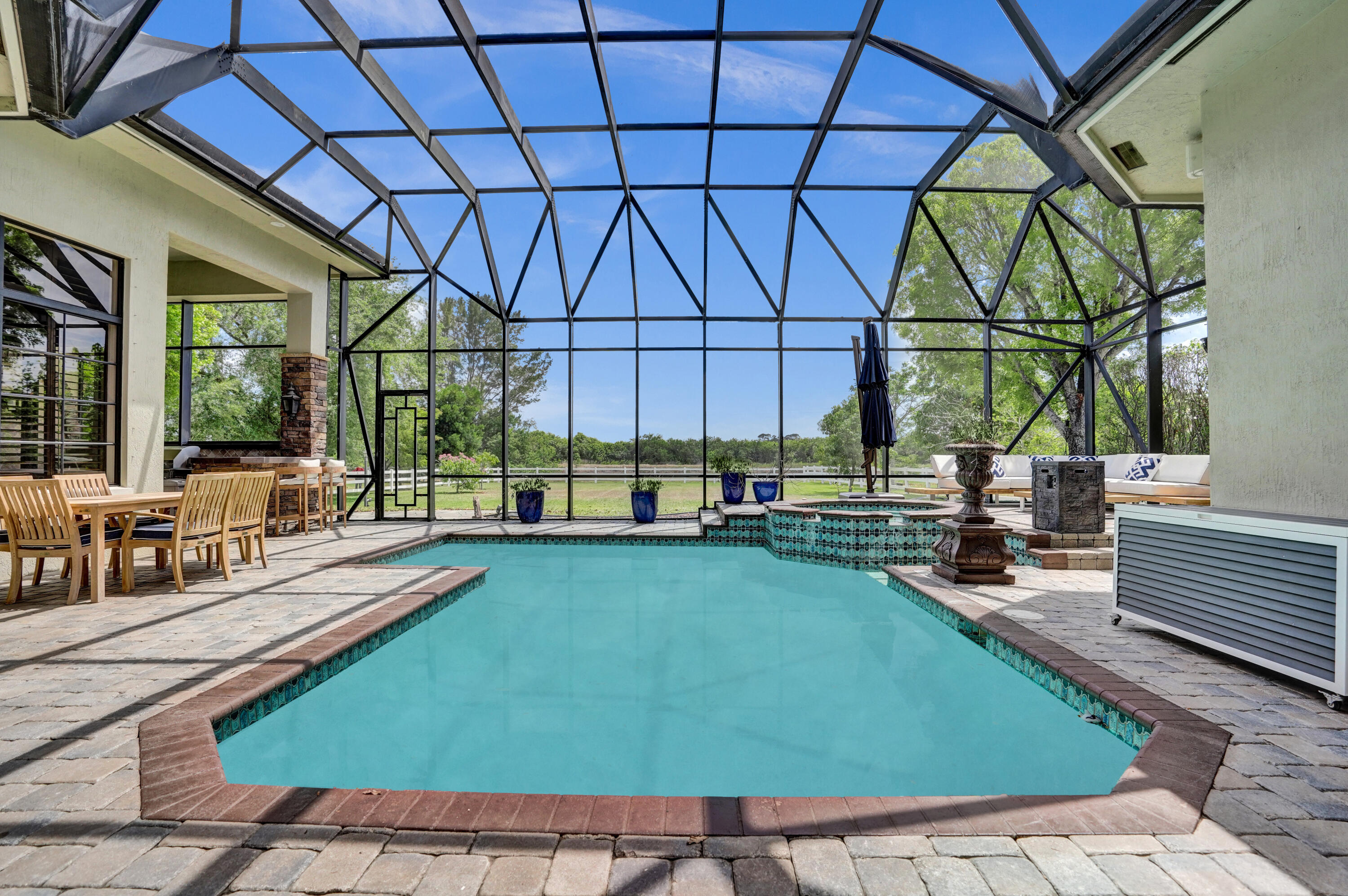 9210 Equus Circle Boynton Beach, FL 33472 - Photo 39 of 75 a view of swimming pool with outdoor seating and a patio