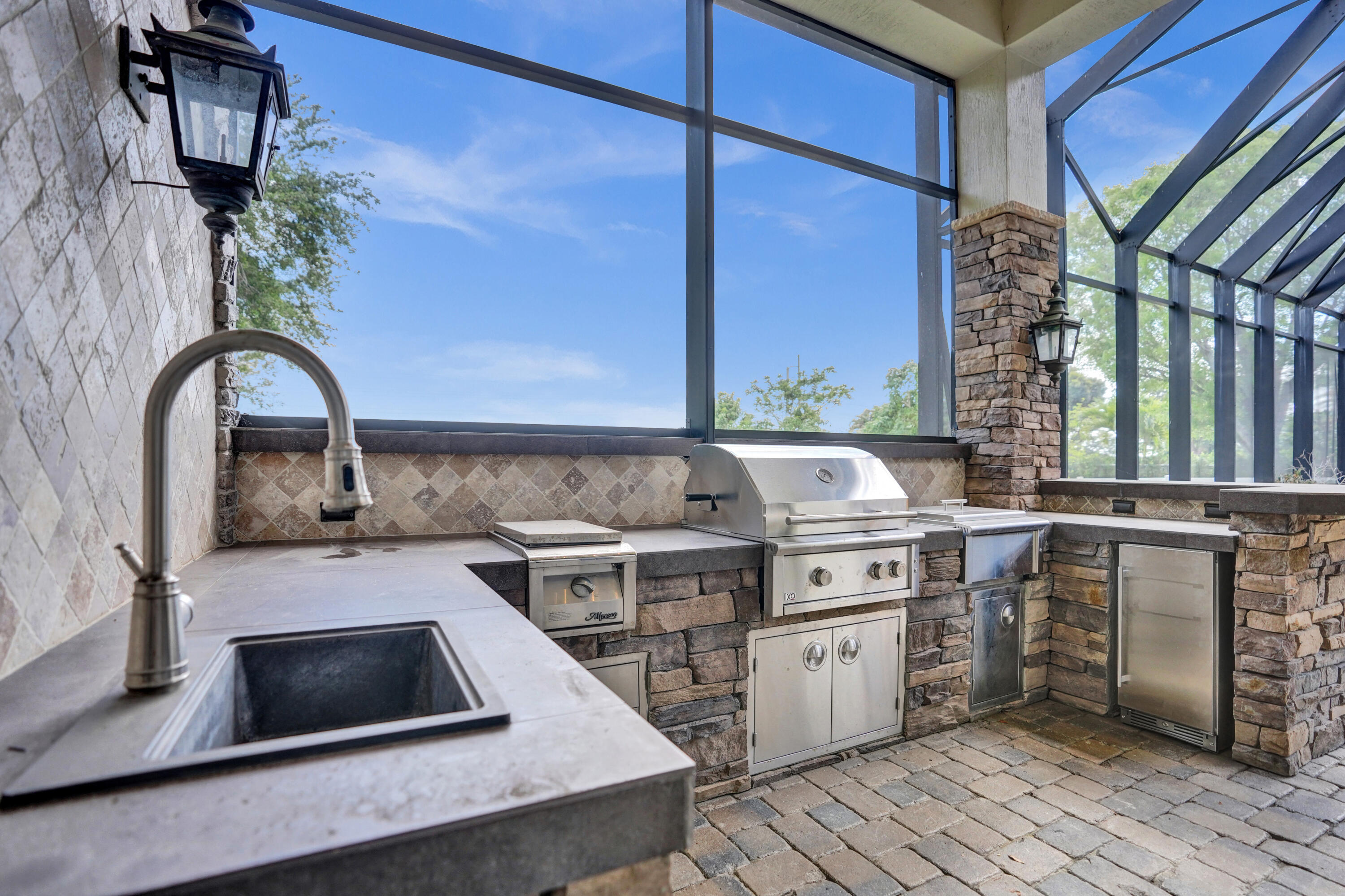 9210 Equus Circle Boynton Beach, FL 33472 - Photo 43 of 75 a kitchen with a stove and a sink