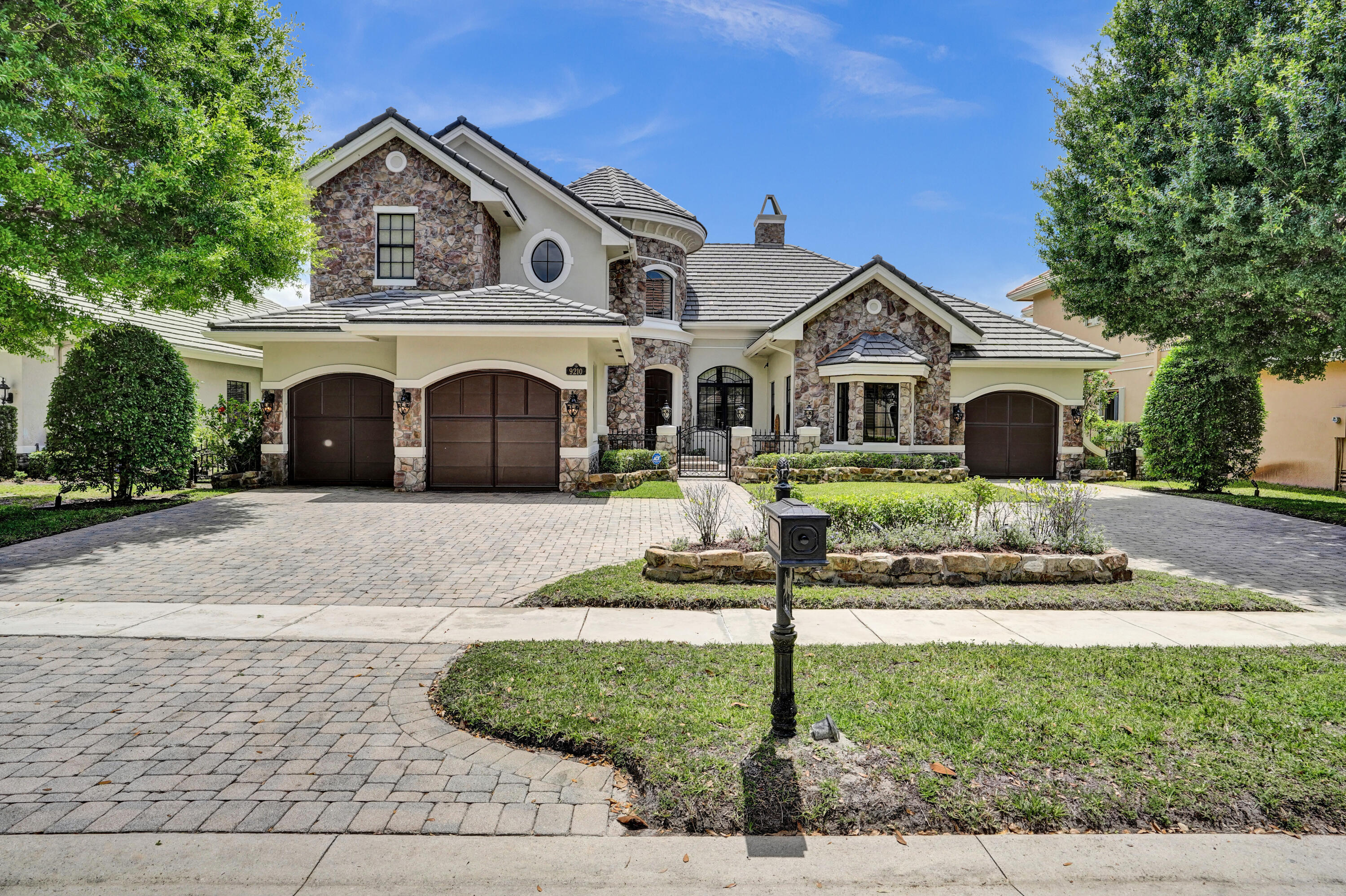 9210 Equus Circle Boynton Beach, FL 33472 - Photo 48 of 75 a front view of a house with a yard