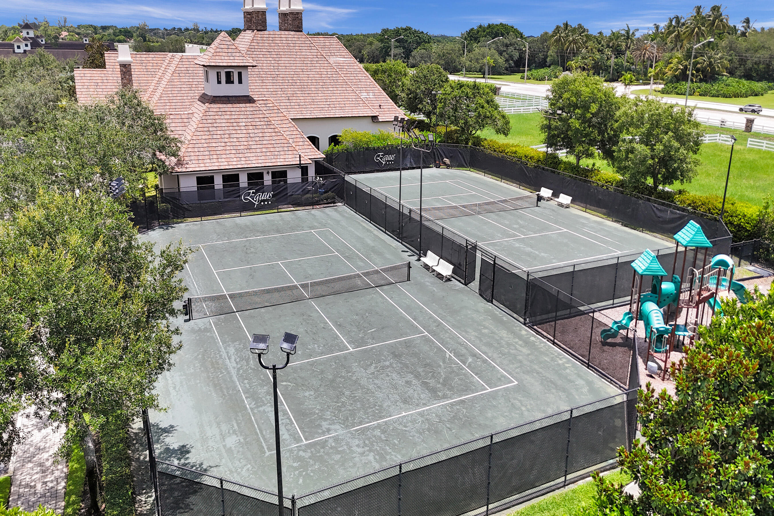 9210 Equus Circle Boynton Beach, FL 33472 - Photo 70 of 75 an aerial view of a house with swimming pool and outdoor seating