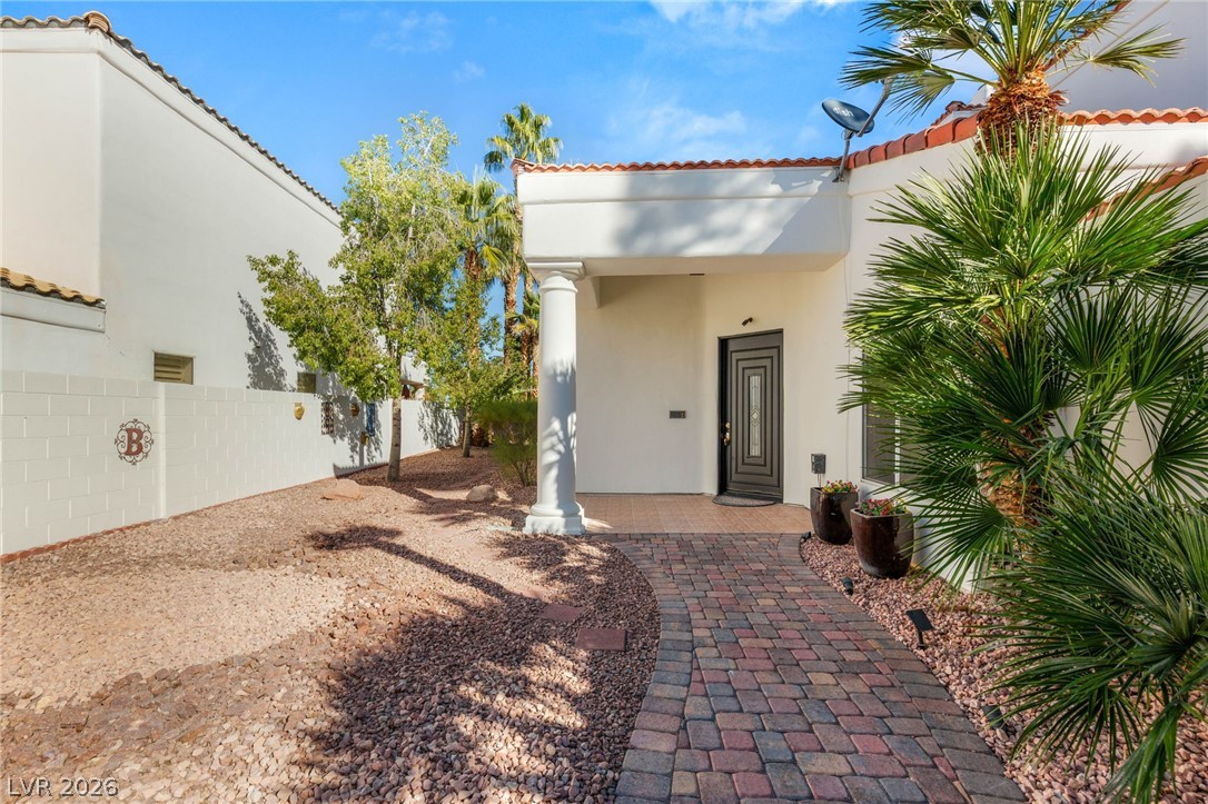 2104 Inverness Drive Henderson, NV 89074 - Photo 3 of 51 View of exterior entry featuring stucco siding and a tile roof