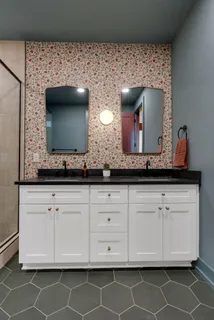 a bedroom with a bed and a lamp