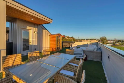 a living room with pool table and a flat screen tv