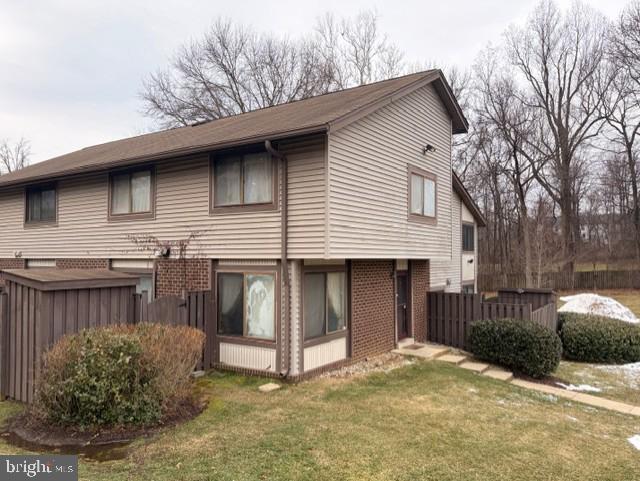 109 Swiss Gap Road, Unit 41 Upper Marlboro, MD 20774 - Photo 2 of 11 a view of a house with a yard covered in snow