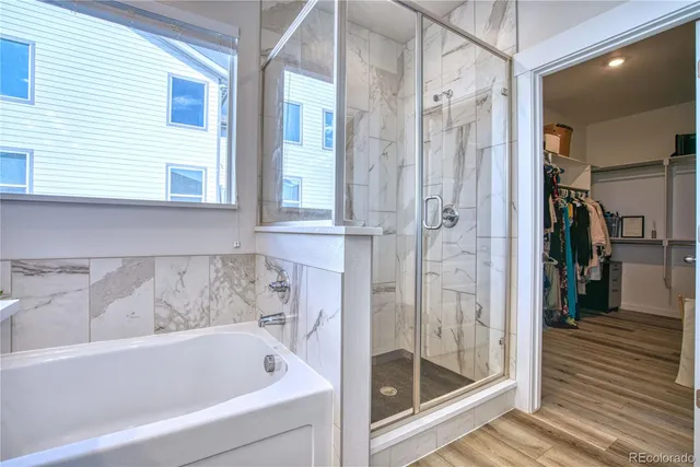 a bathroom with a bathtub and a shower