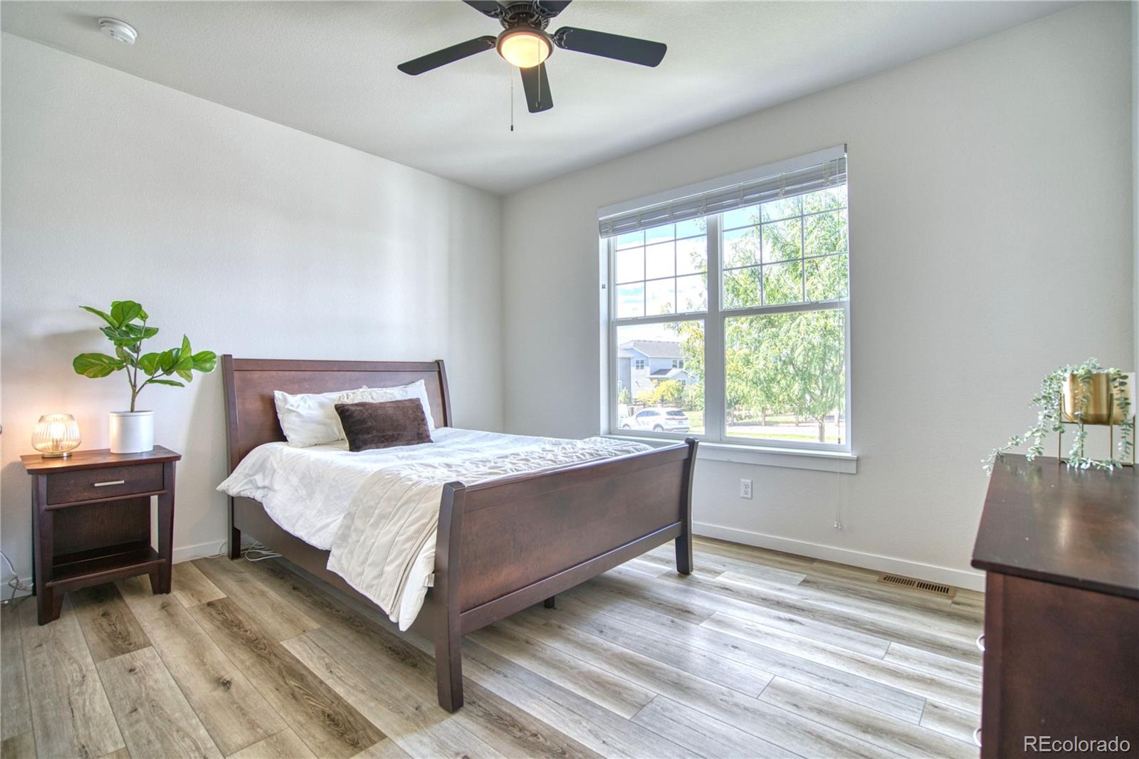 848 Lowrey Lane Berthoud, CO 80513 - Photo 15 of 36 a bedroom with bed and window