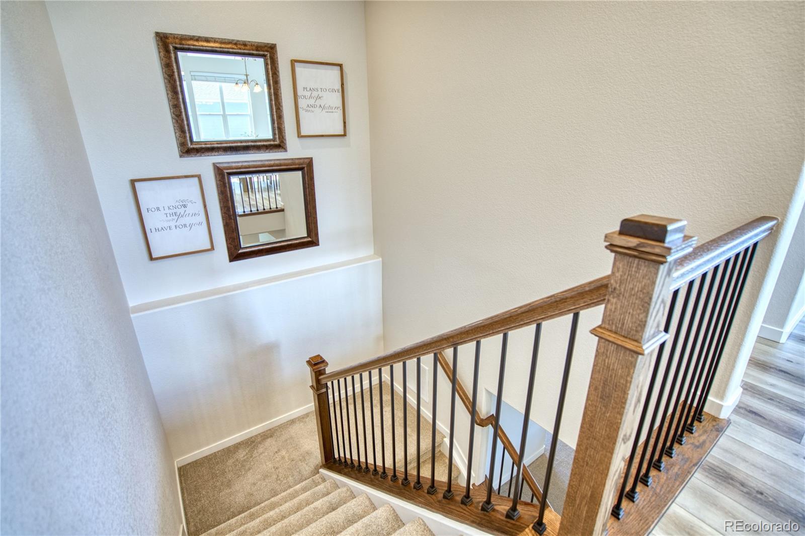 848 Lowrey Lane Berthoud, CO 80513 - Photo 18 of 36 a view of a hallway with wooden floor and windows