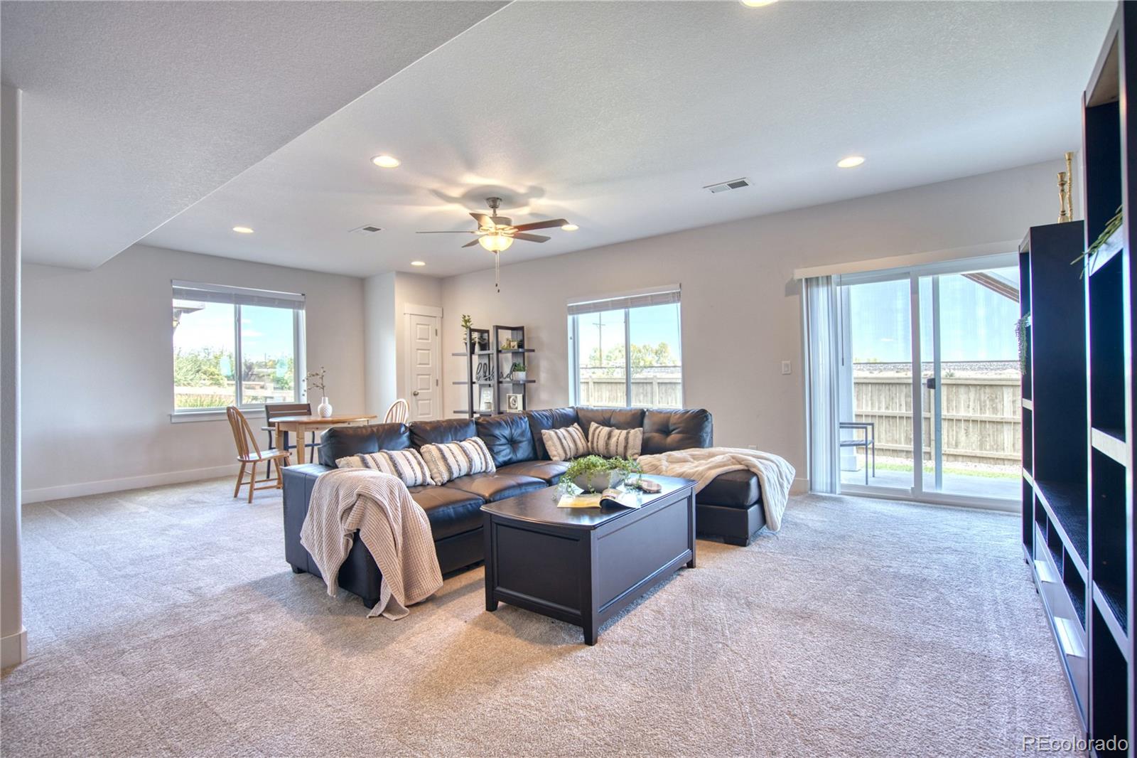 848 Lowrey Lane Berthoud, CO 80513 - Photo 19 of 36 a living room with furniture and a large window