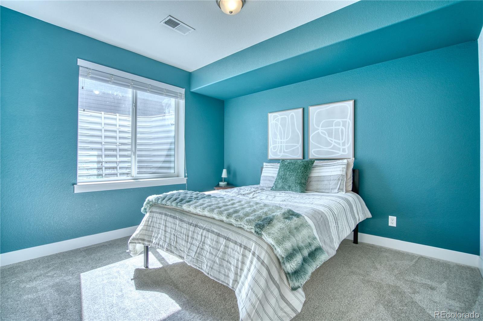 848 Lowrey Lane Berthoud, CO 80513 - Photo 22 of 36 a bedroom with a bed and a window