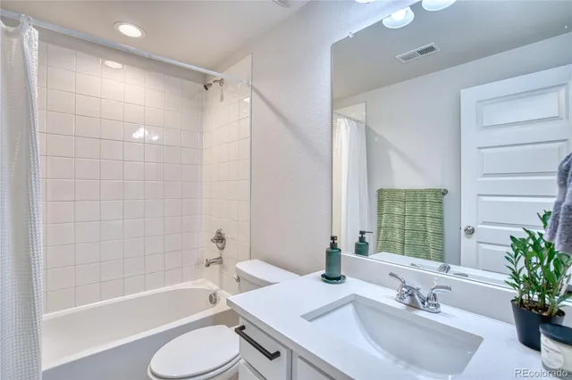 a bathroom with a sink a toilet and a bathtub