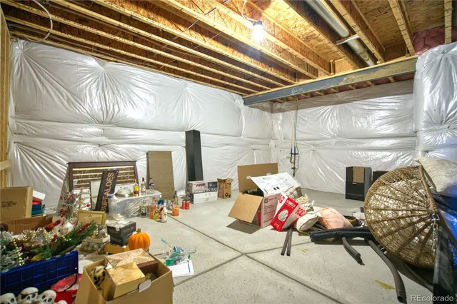 a living room with lots of furniture and flowers