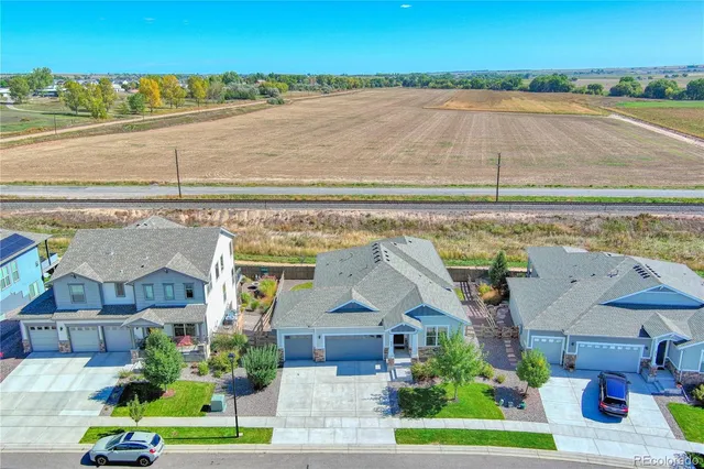 an aerial view of a house with a lake view