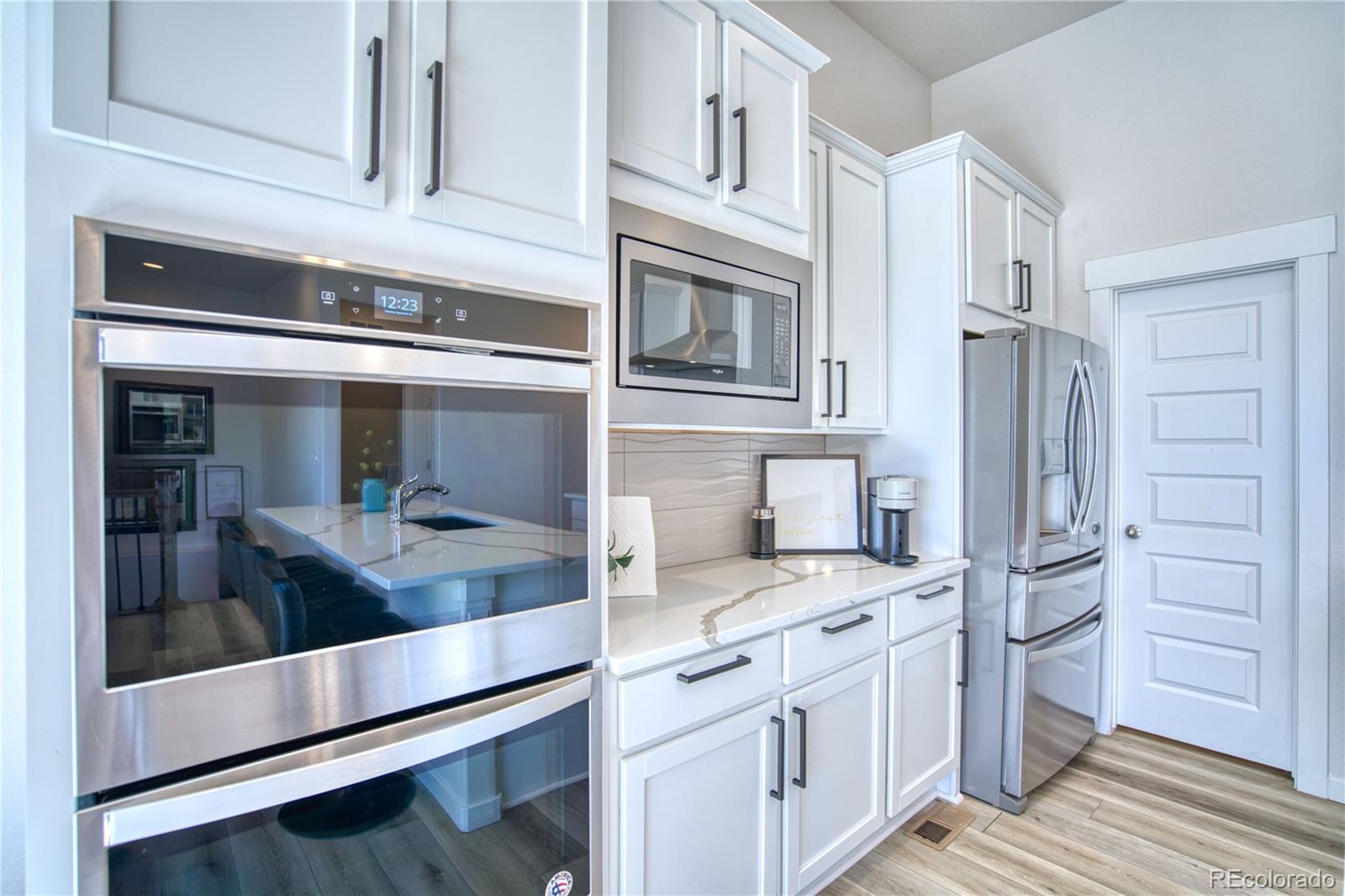 848 Lowrey Lane Berthoud, CO 80513 - Photo 3 of 36 a kitchen with stainless steel appliances granite countertop a refrigerator and a stove