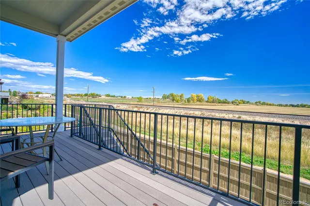a view of a balcony with wooden floor