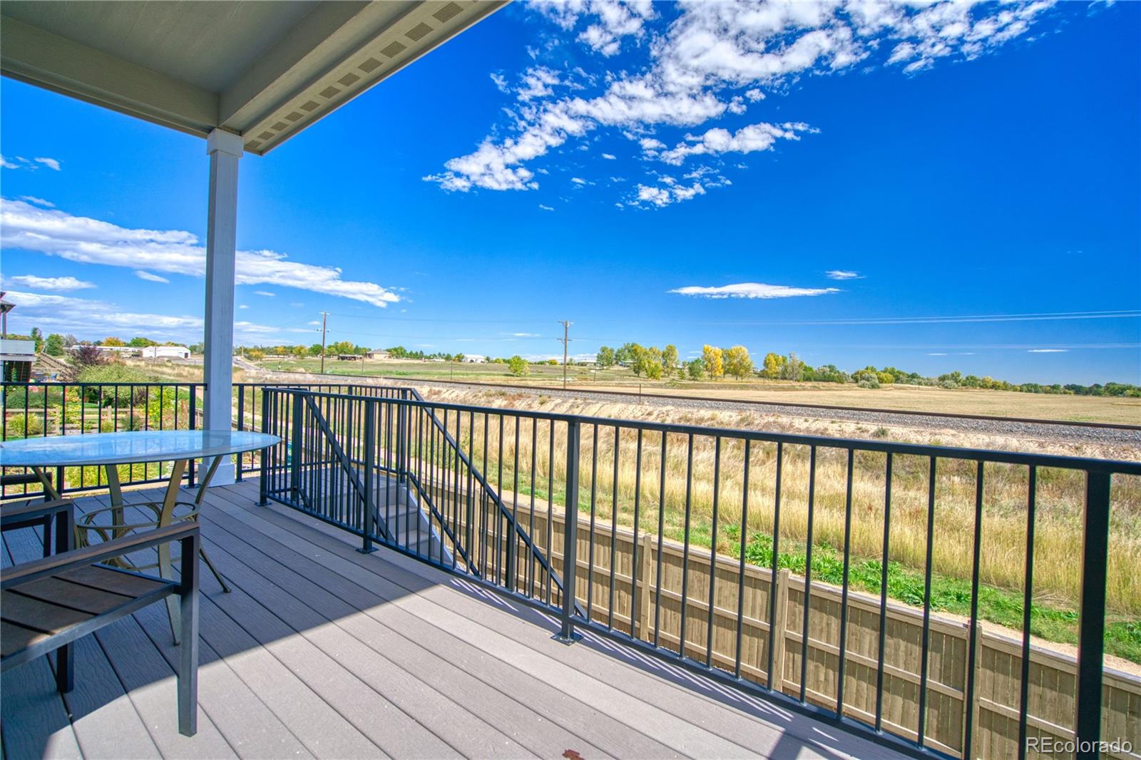 848 Lowrey Lane Berthoud, CO 80513 - Photo 31 of 36 a view of a balcony with wooden floor