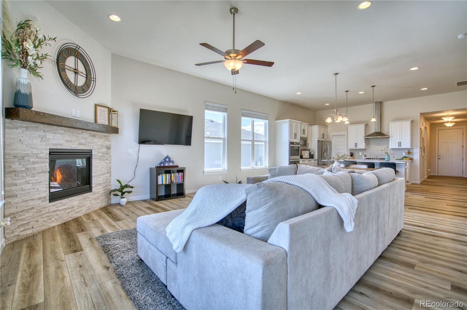 848 Lowrey Lane Berthoud, CO 80513 - Photo 9 of 36 a living room with furniture and a fireplace