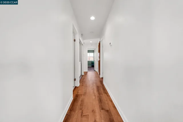 a bedroom with a bed and a potted plant