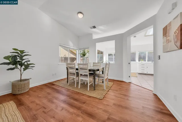 a view of a livingroom with furniture and a floor to ceiling window
