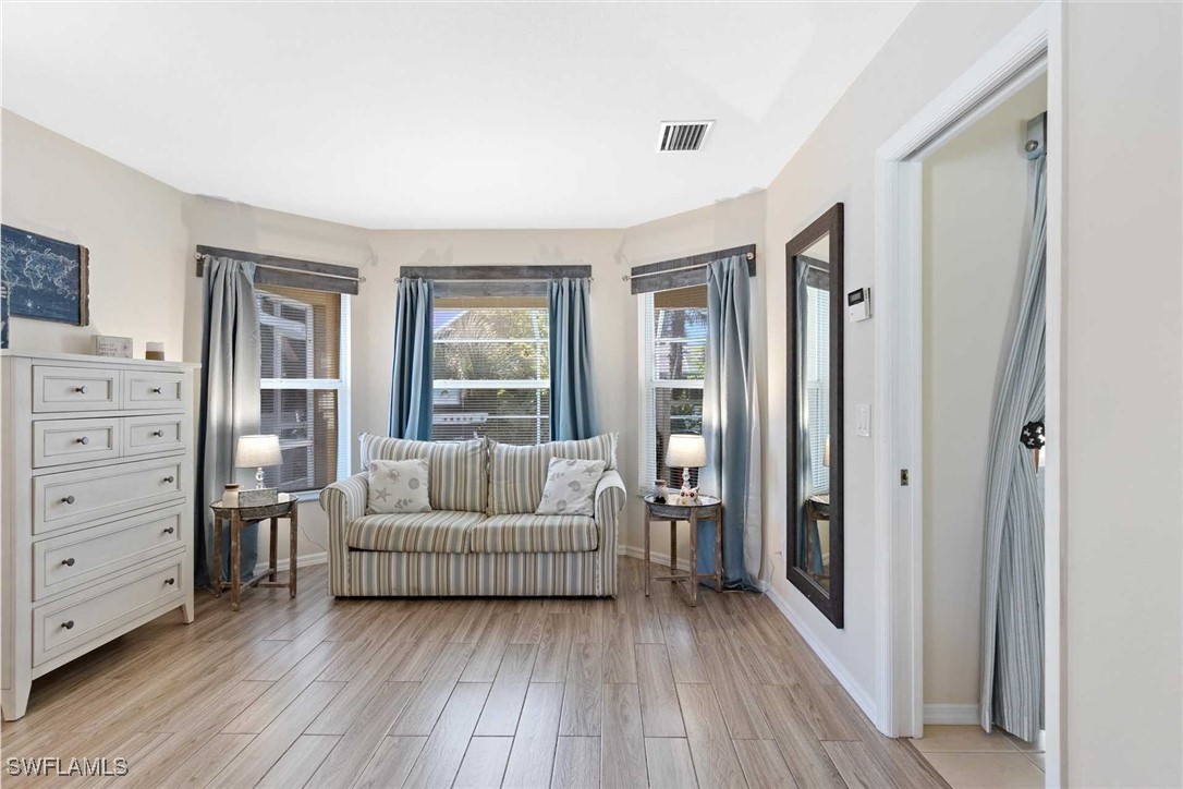4810 Southwest 25th Place Cape Coral, FL 33914 - Photo 12 of 29 a living room with furniture and a window