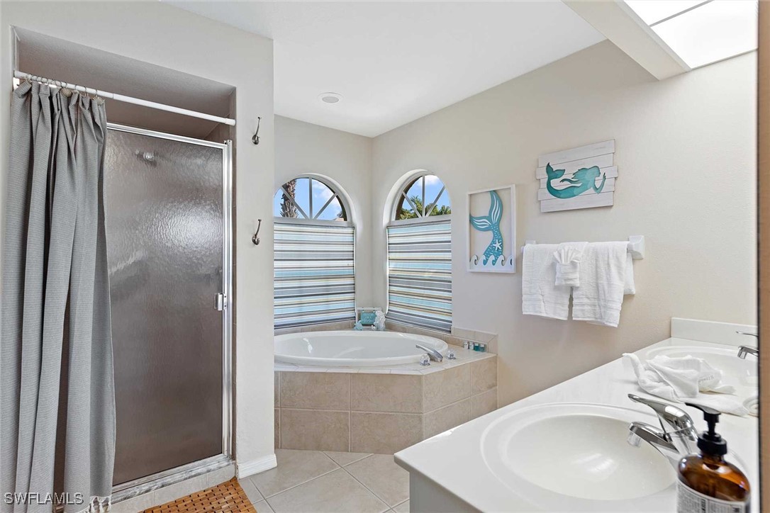 4810 Southwest 25th Place Cape Coral, FL 33914 - Photo 14 of 29 a bathroom with a sink and a mirror