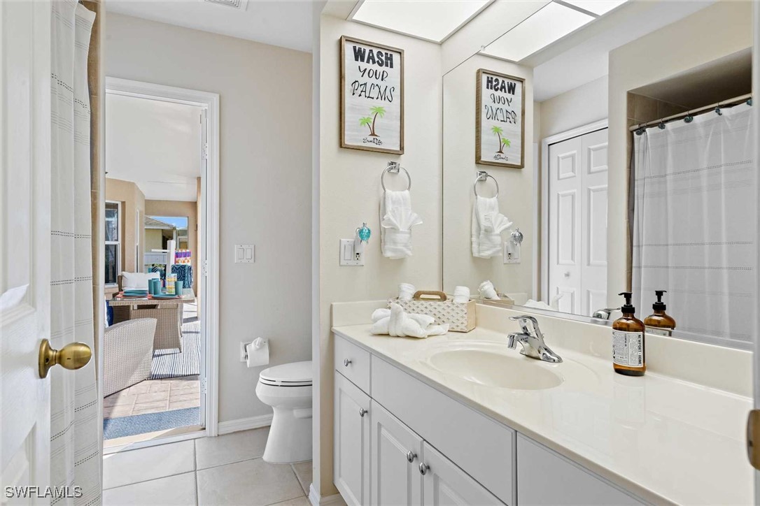 4810 Southwest 25th Place Cape Coral, FL 33914 - Photo 19 of 29 a bathroom with a sink toilet and shower