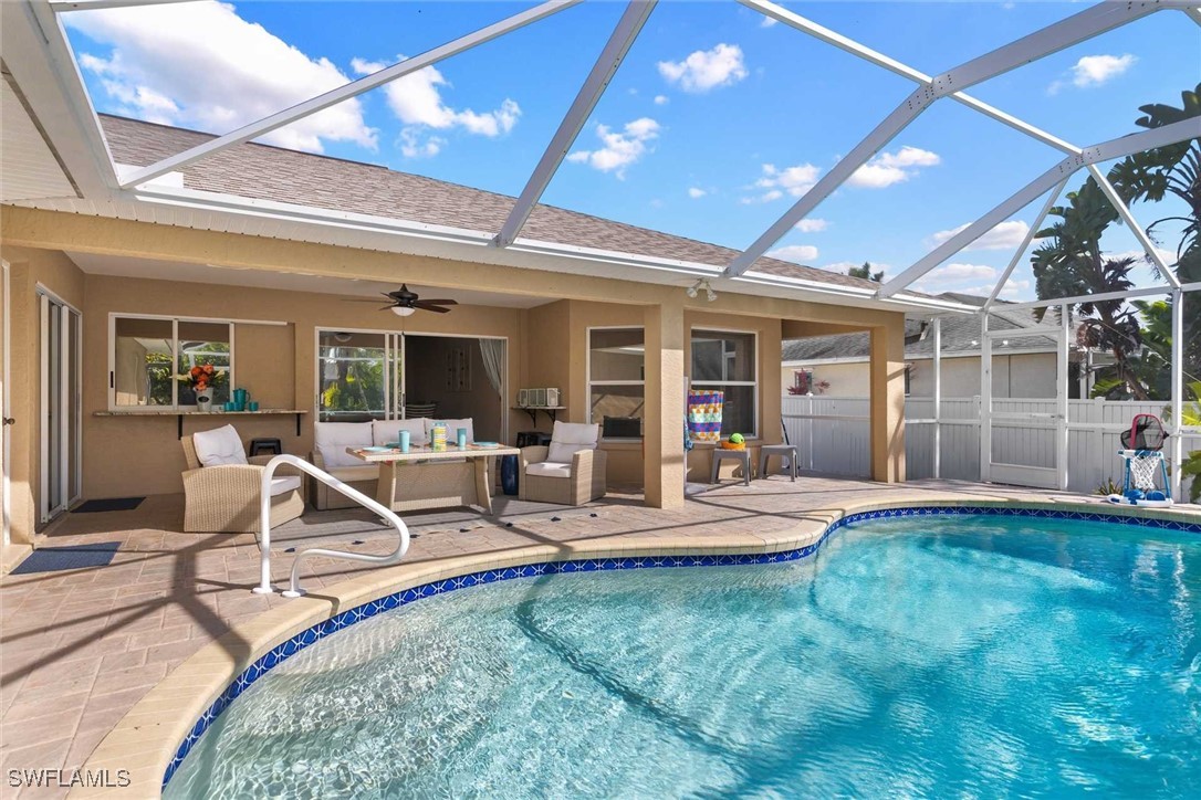4810 Southwest 25th Place Cape Coral, FL 33914 - Photo 22 of 29 a view of a house with backyard porch and sitting area