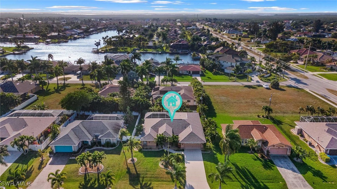 4810 Southwest 25th Place Cape Coral, FL 33914 - Photo 24 of 29 an aerial view of residential houses with outdoor space
