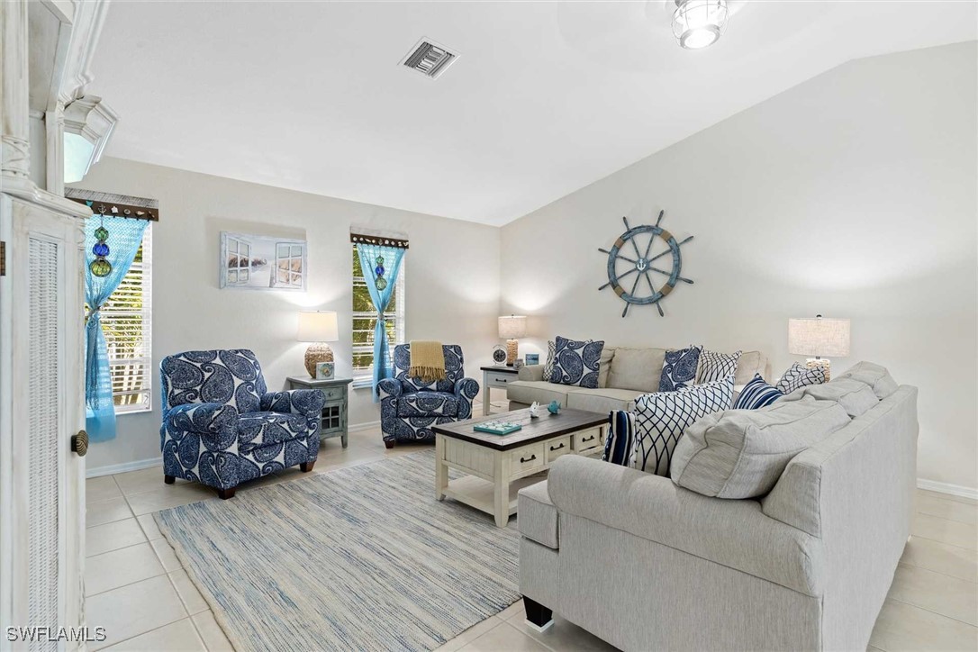 4810 Southwest 25th Place Cape Coral, FL 33914 - Photo 28 of 29 a living room with furniture and stairs