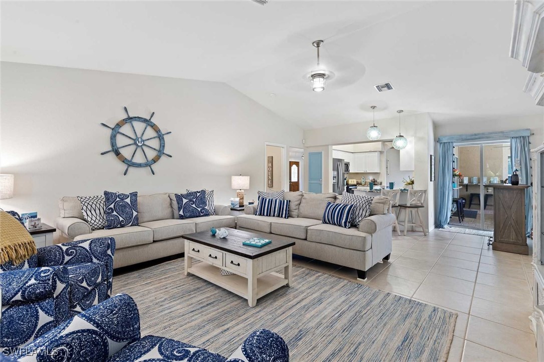 4810 Southwest 25th Place Cape Coral, FL 33914 - Photo 5 of 29 a living room with furniture or couch and a view of kitchen