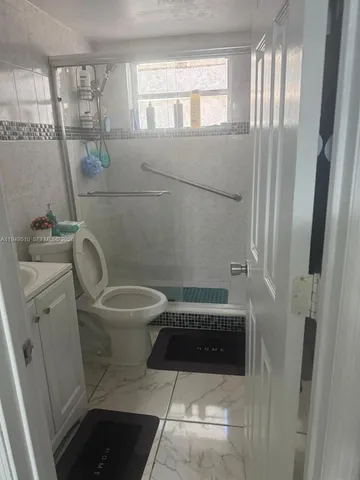 a bathroom with a toilet and a sink