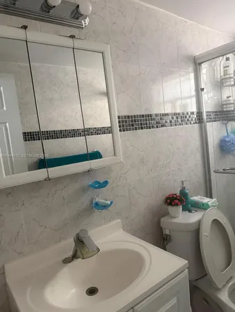 a bathroom with a sink and a toilet
