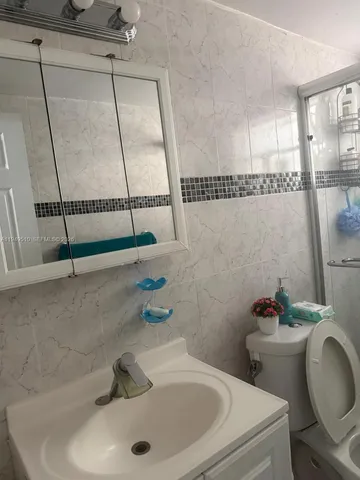 a bathroom with a sink and a toilet