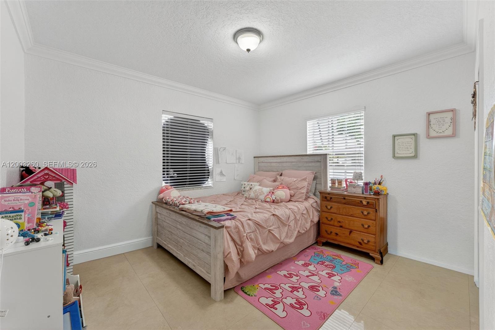 9000 Southwest 40th Terrace Miami, FL 33165 - Photo 11 of 23 a bedroom with a bed and a window