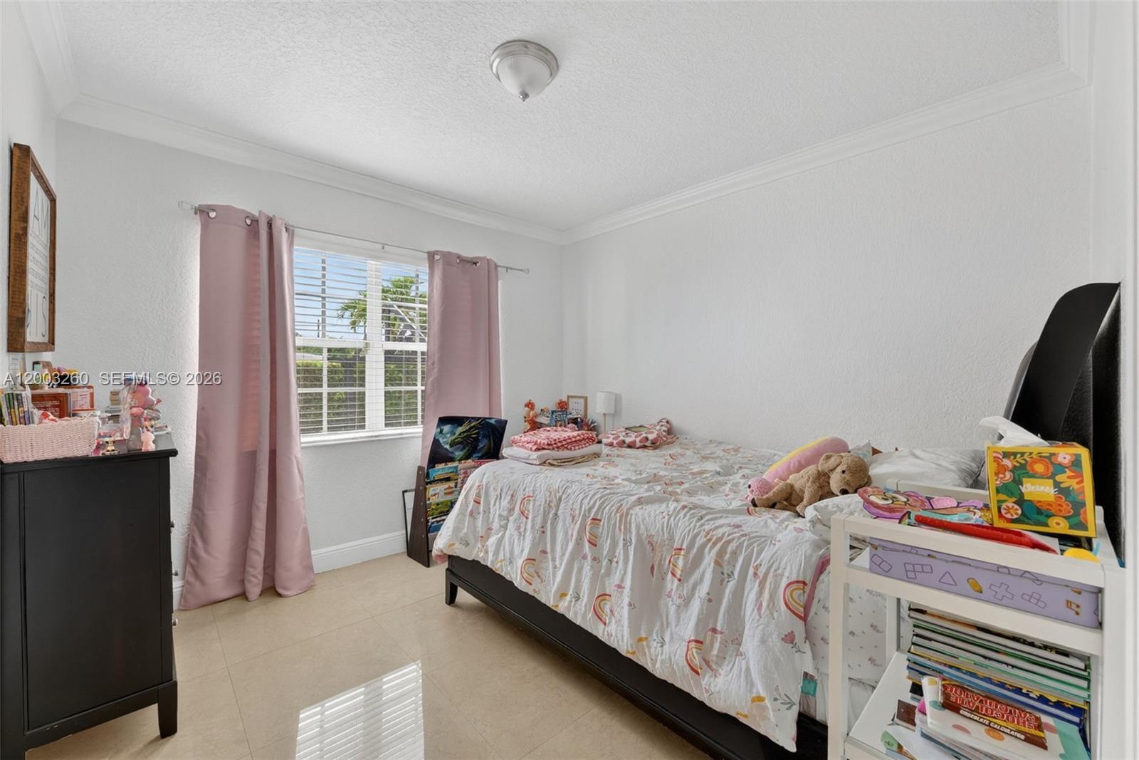 9000 Southwest 40th Terrace Miami, FL 33165 - Photo 12 of 23 a bed room with a bed and a window