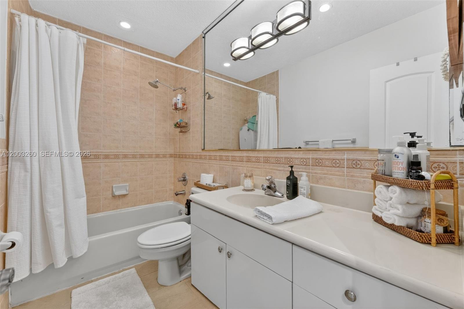 9000 Southwest 40th Terrace Miami, FL 33165 - Photo 13 of 23 a bathroom with a granite countertop sink a toilet and shower