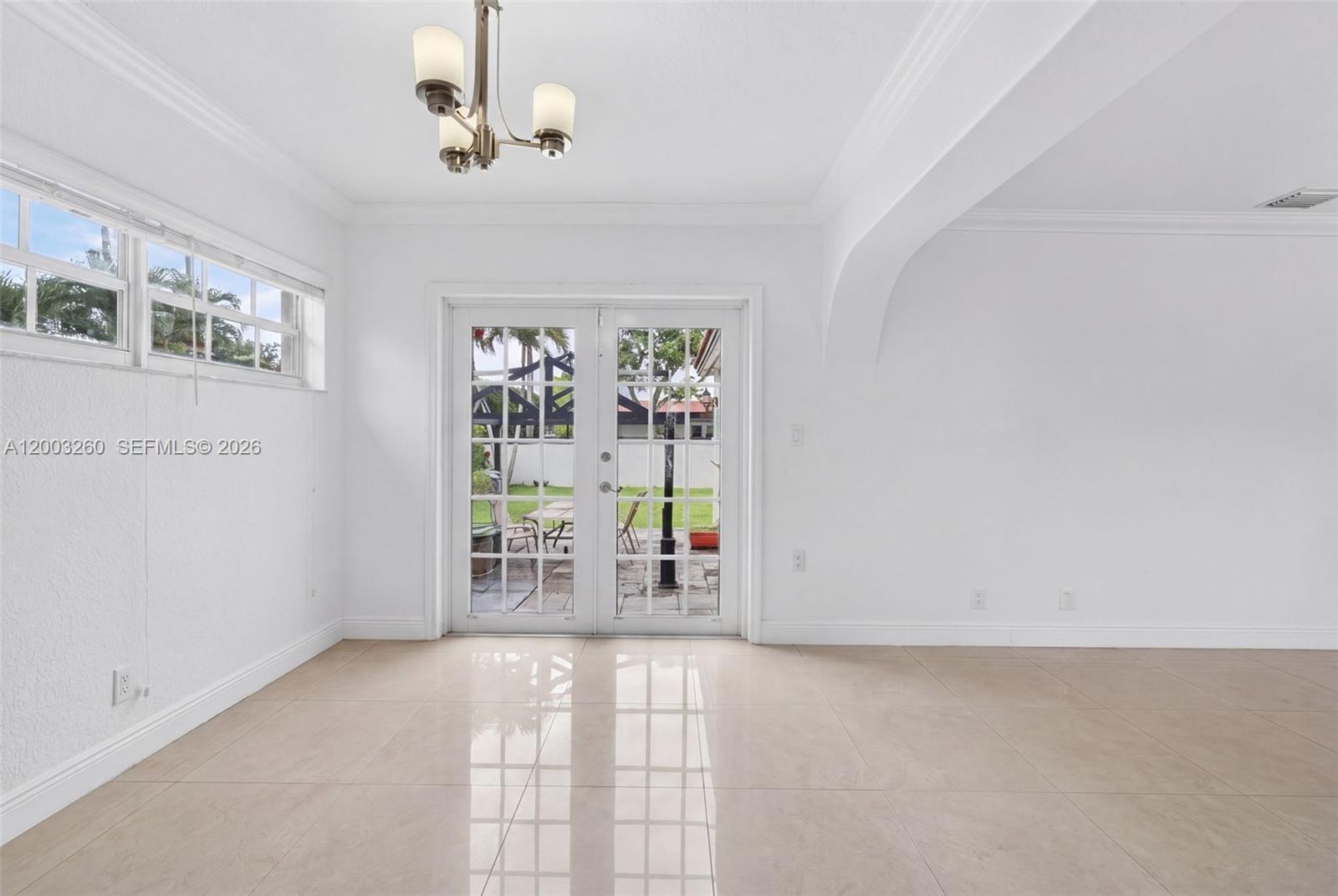 9000 Southwest 40th Terrace Miami, FL 33165 - Photo 6 of 23 a view of an empty room with window