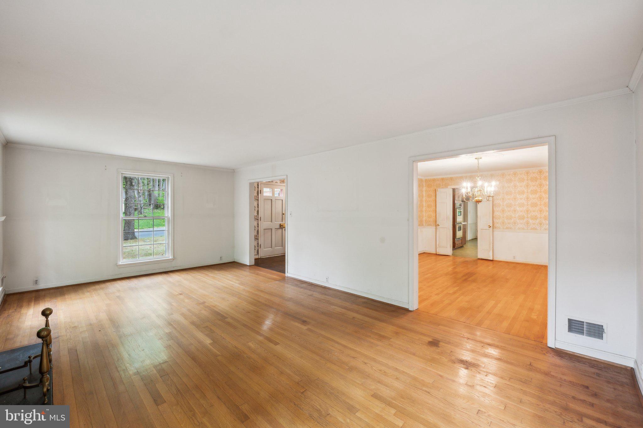 7604 Hackamore Drive Potomac, MD 20854 - Photo 13 of 56 a view of an empty room with wooden floor and a window