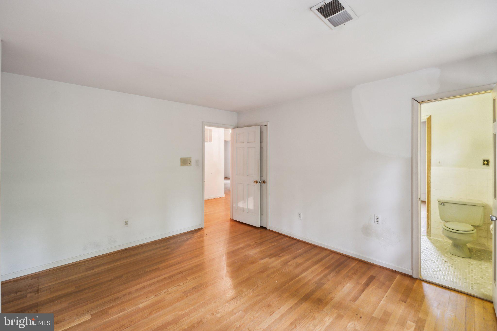 7604 Hackamore Drive Potomac, MD 20854 - Photo 21 of 56 a view of an empty room and wooden floor
