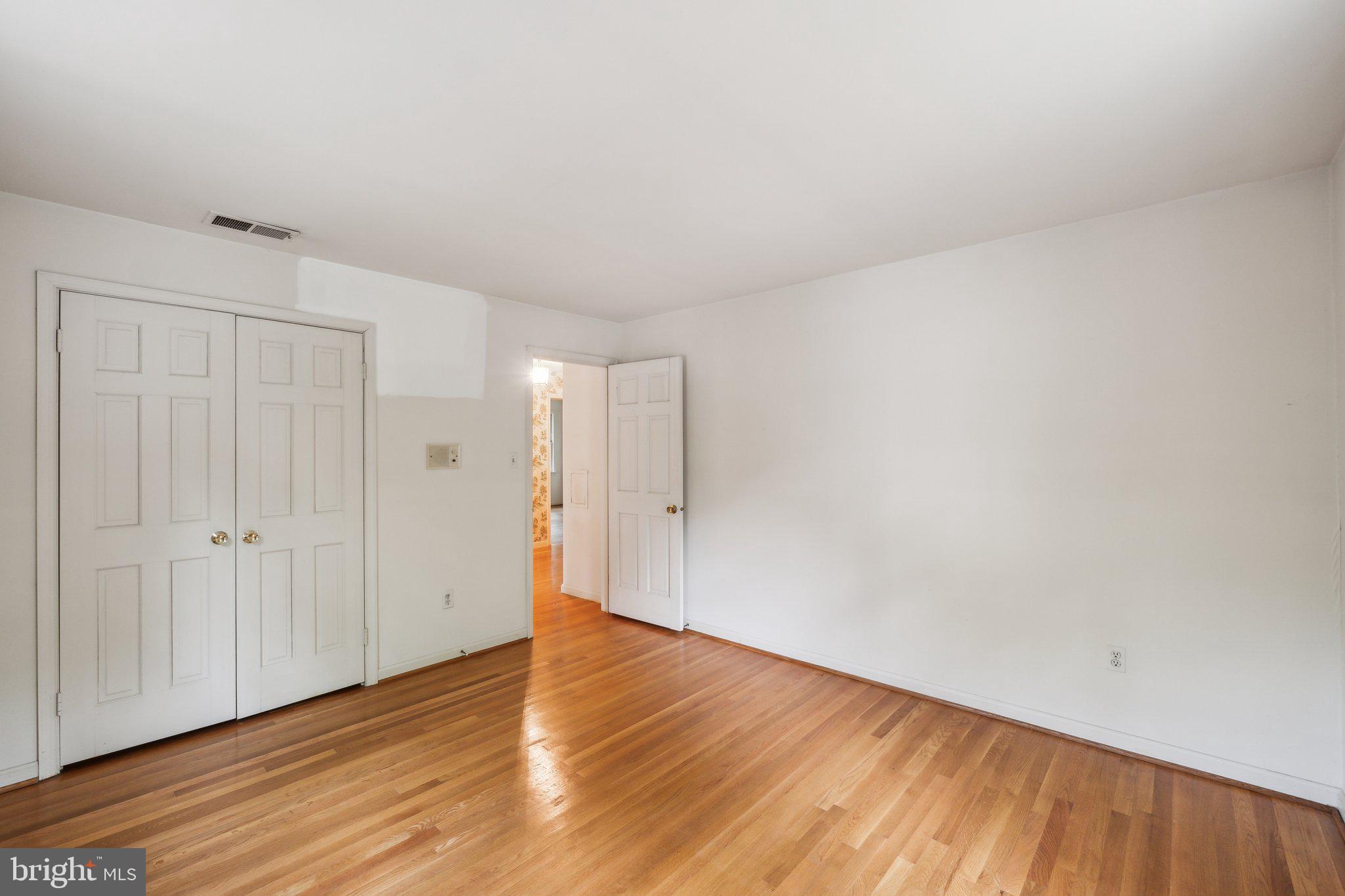 7604 Hackamore Drive Potomac, MD 20854 - Photo 26 of 56 a view of an empty room with wooden floor