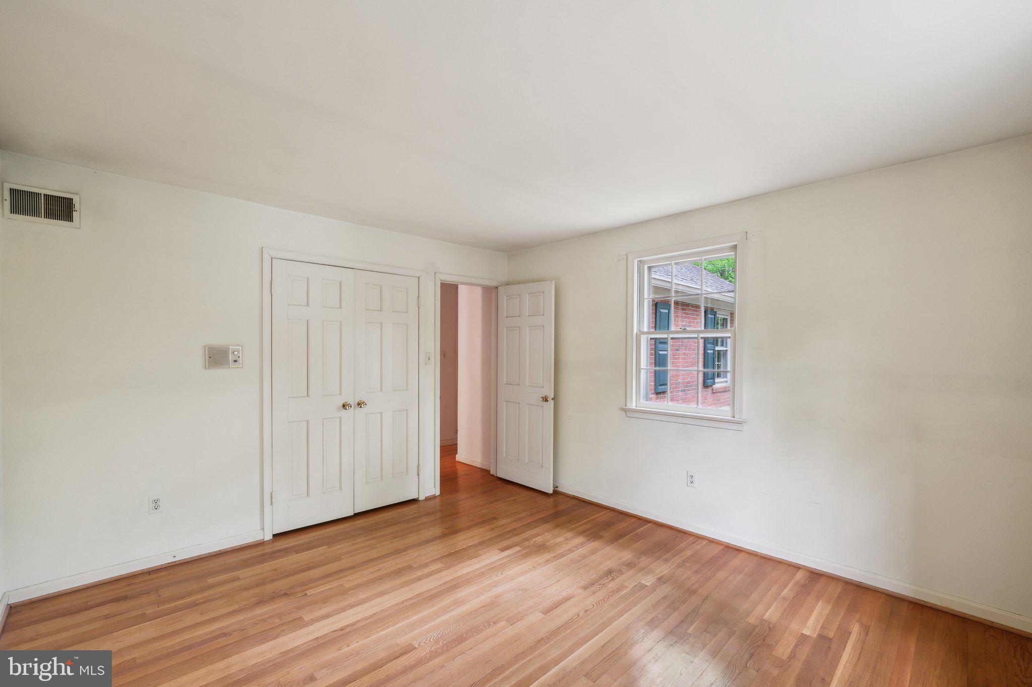 7604 Hackamore Drive Potomac, MD 20854 - Photo 29 of 56 a view of an empty room with wooden floor