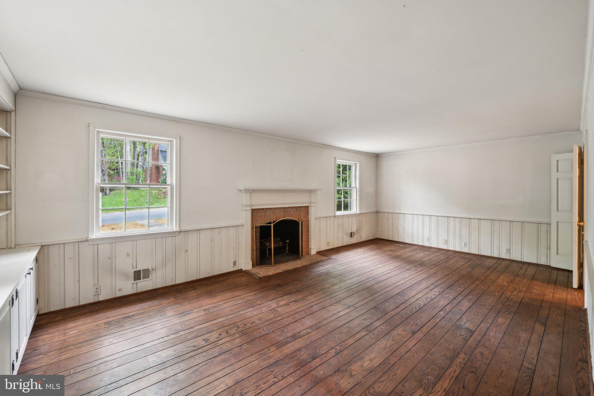 7604 Hackamore Drive Potomac, MD 20854 - Photo 3 of 56 a view of an empty room with wooden floor and a window