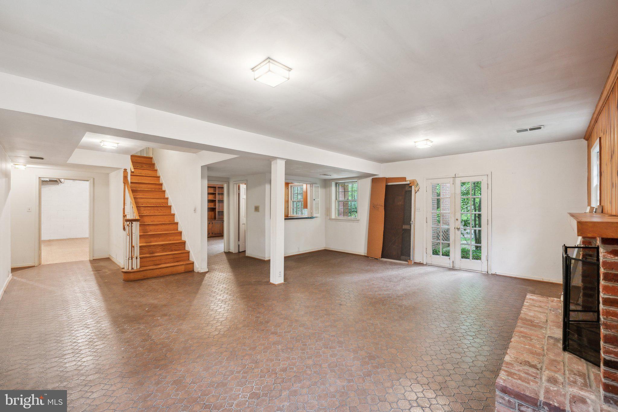 7604 Hackamore Drive Potomac, MD 20854 - Photo 32 of 56 an empty room with wooden floor and windows