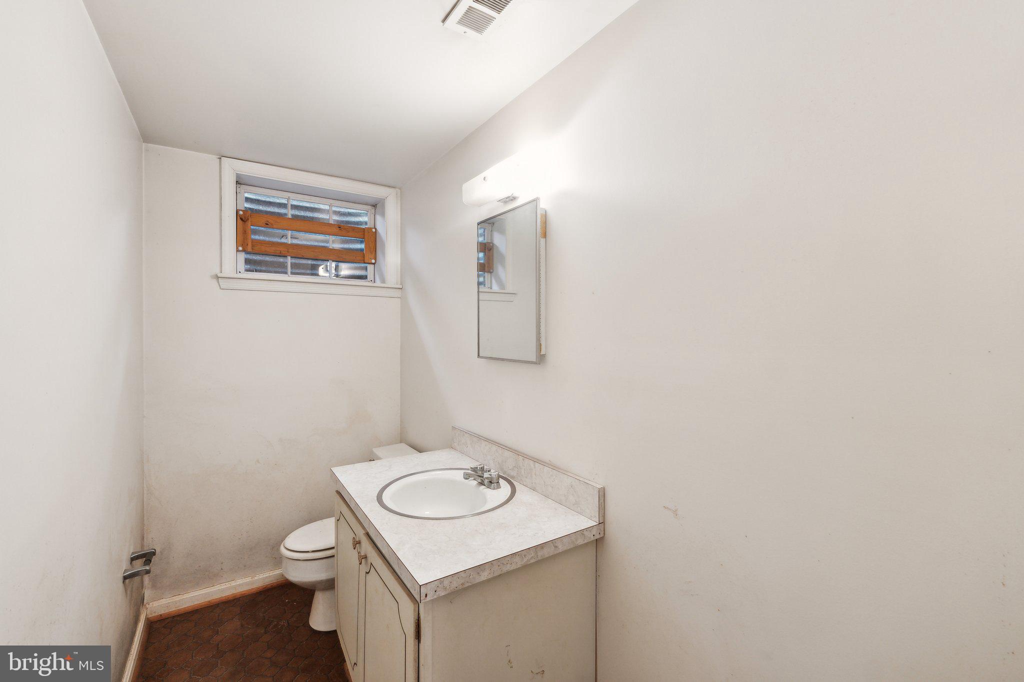 7604 Hackamore Drive Potomac, MD 20854 - Photo 37 of 56 a bathroom with a sink and a toilet
