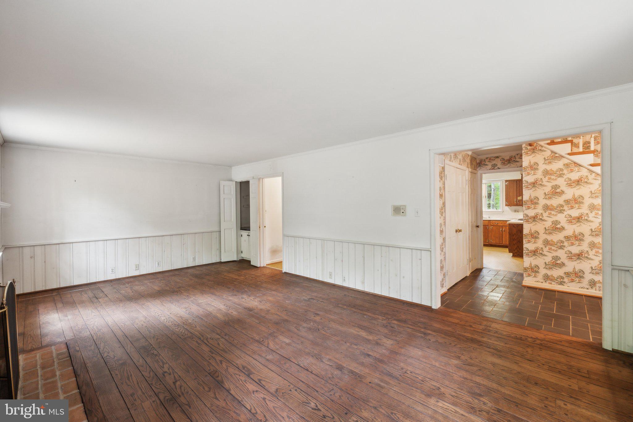 7604 Hackamore Drive Potomac, MD 20854 - Photo 38 of 56 a view of an empty room with wooden floor and a window