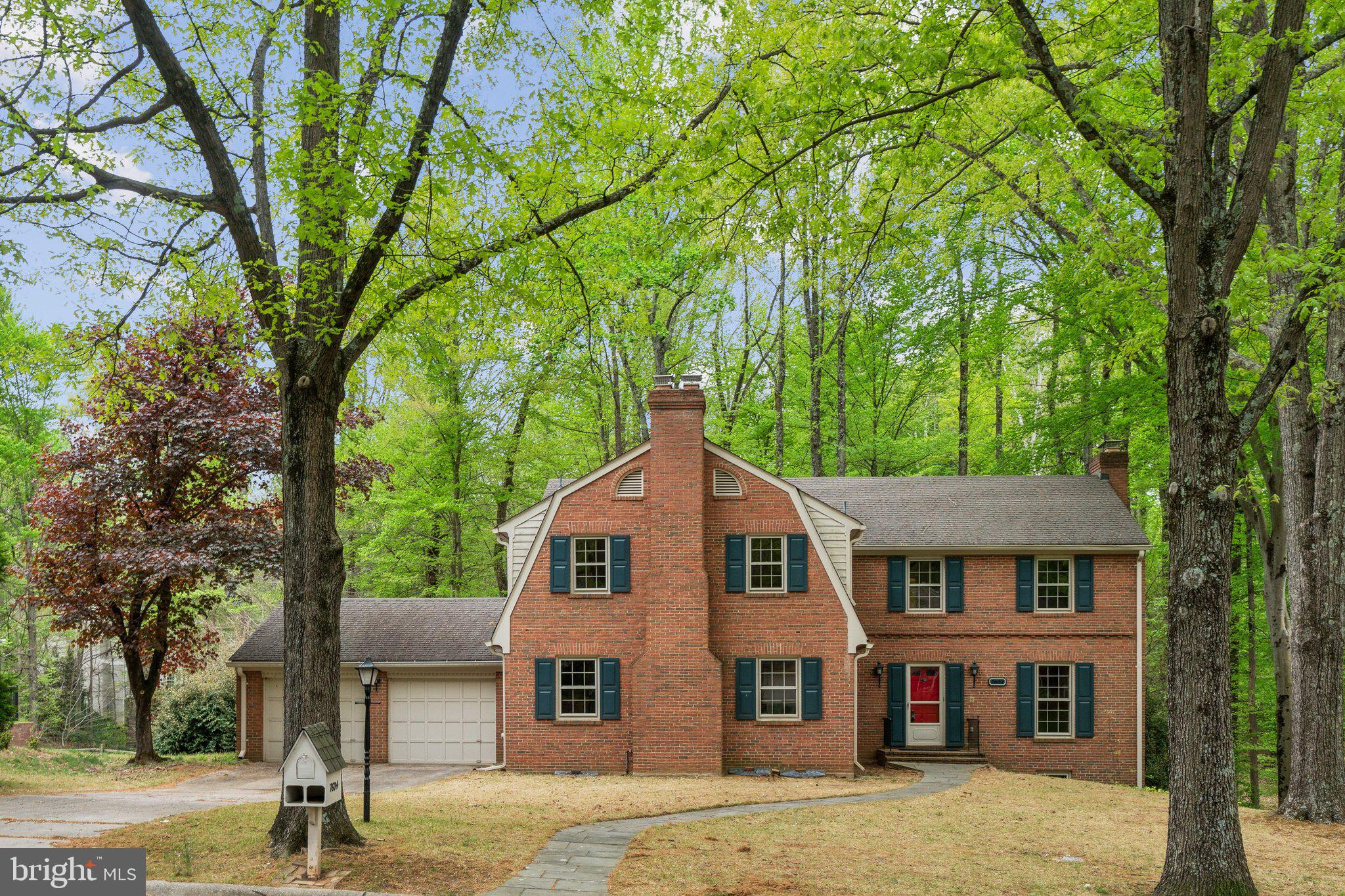 7604 Hackamore Drive Potomac, MD 20854 - Photo 47 of 56 a front view of a house with a yard